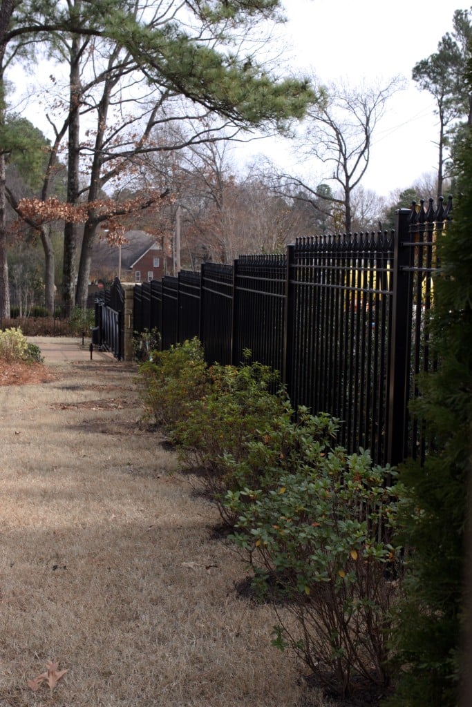 Iron Fence Stepped to Follow the Slope and Grade of a Yard