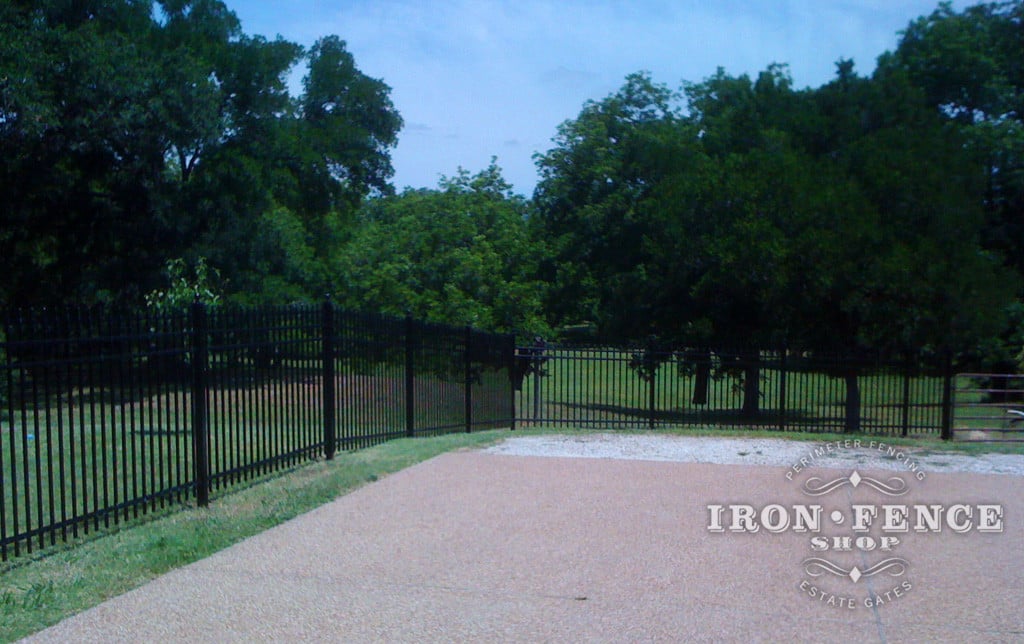 Aluminum Fence can 'rack' which angles the panels to follow yard grade