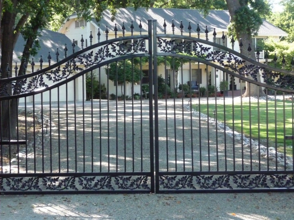 A Custom Iron Driveway Gate with Oak Branch Castings