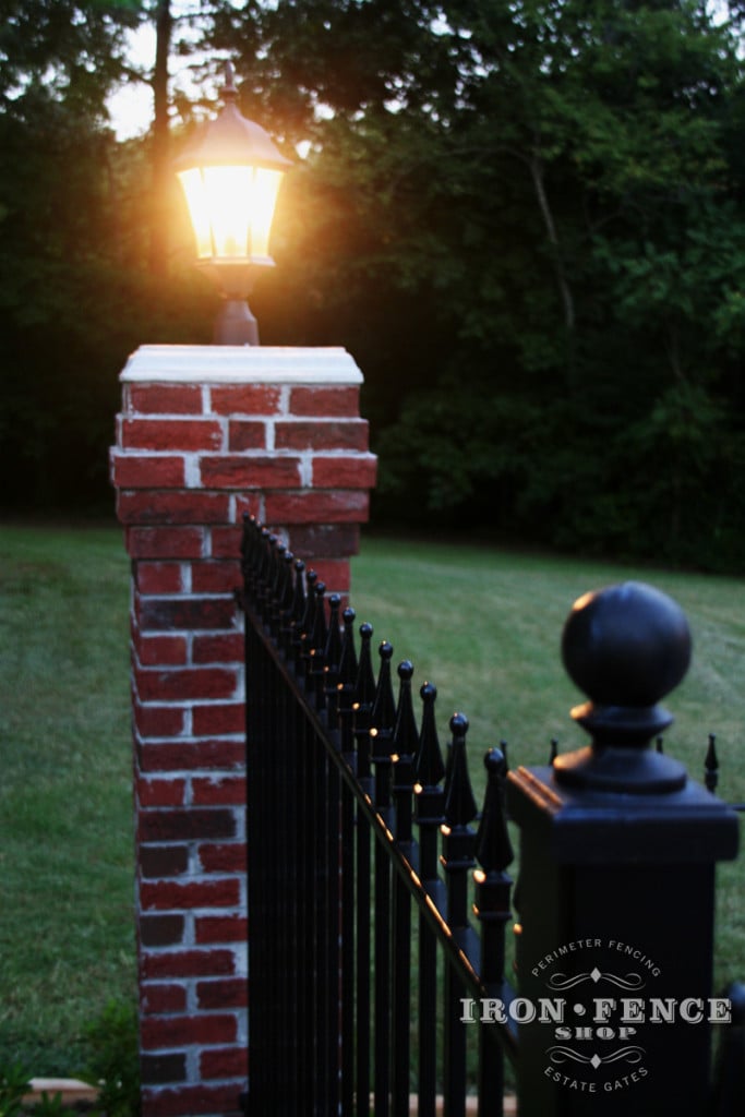 Iron Fence Mounted on Brick