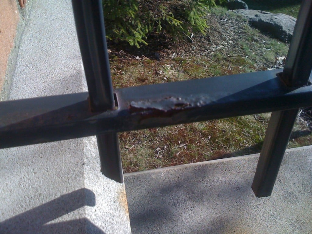 Example of Poorly Prepared Iron Fence Rail with the Finish Bubbling and Peeling