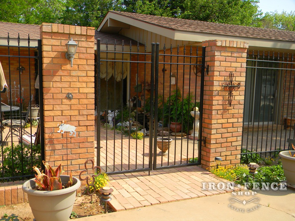 6 Foot Tall Wrought Iron Fence and Gates Surrounding a Courtyard