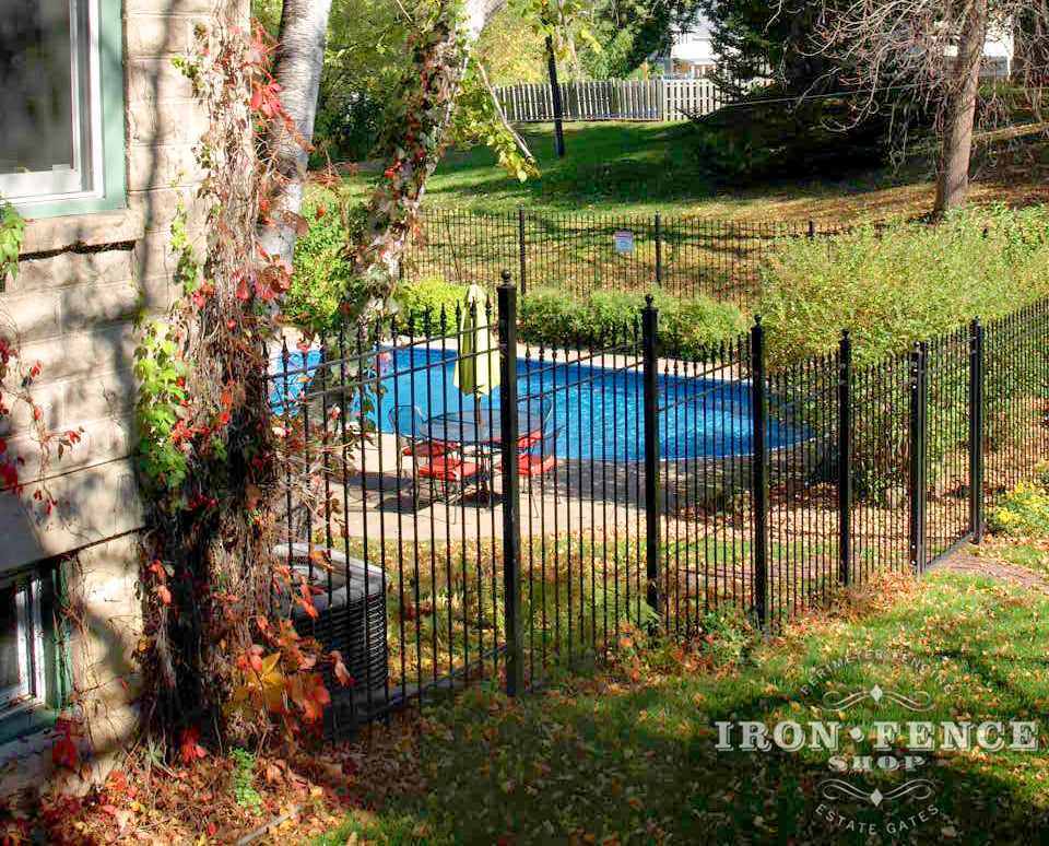 Iron Fence Installed on a Hill 