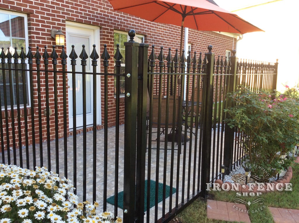 Wrought Iron Fence and Gate used to Enclose a Patio