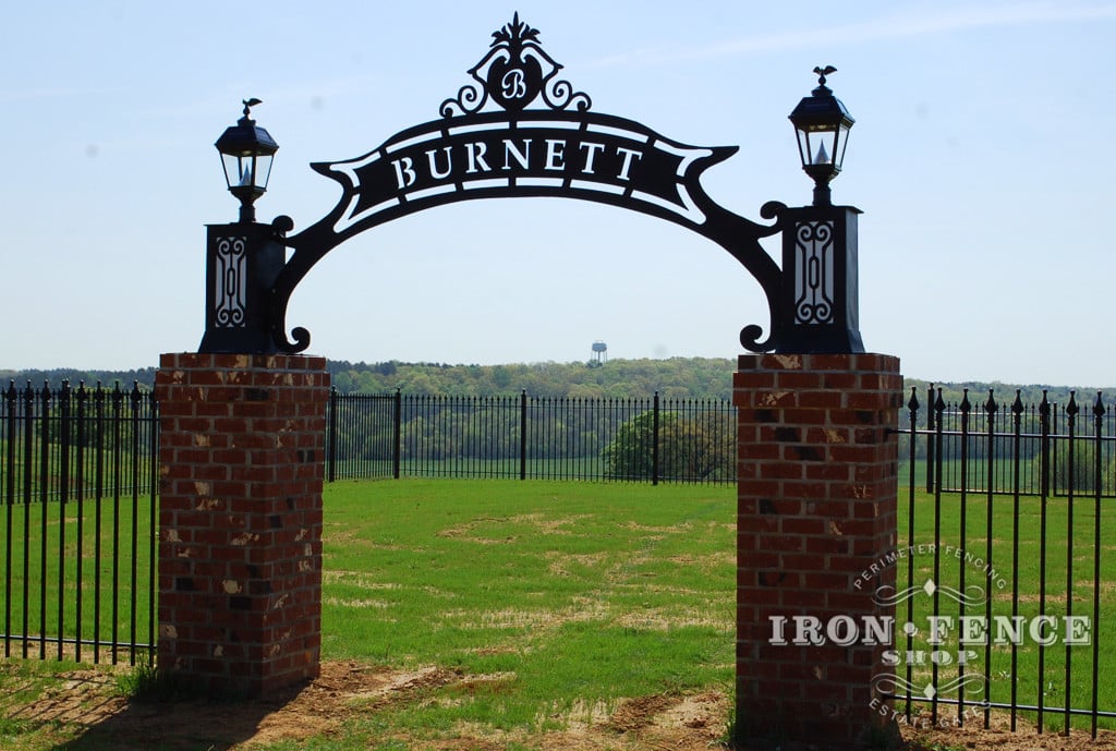 Wrought Iron Fence Surrounding a Family Cemetery with a Local Artist's Iron Sign and 