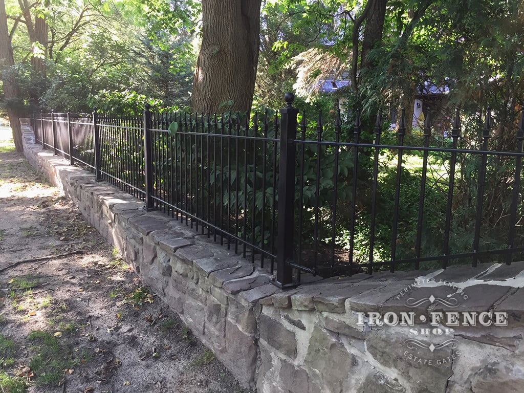 3ft Classic Iron Fence Installed on a Stone Wall Top with Flange Posts