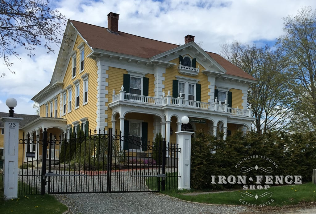 wide wrought iron gates with decorative columns