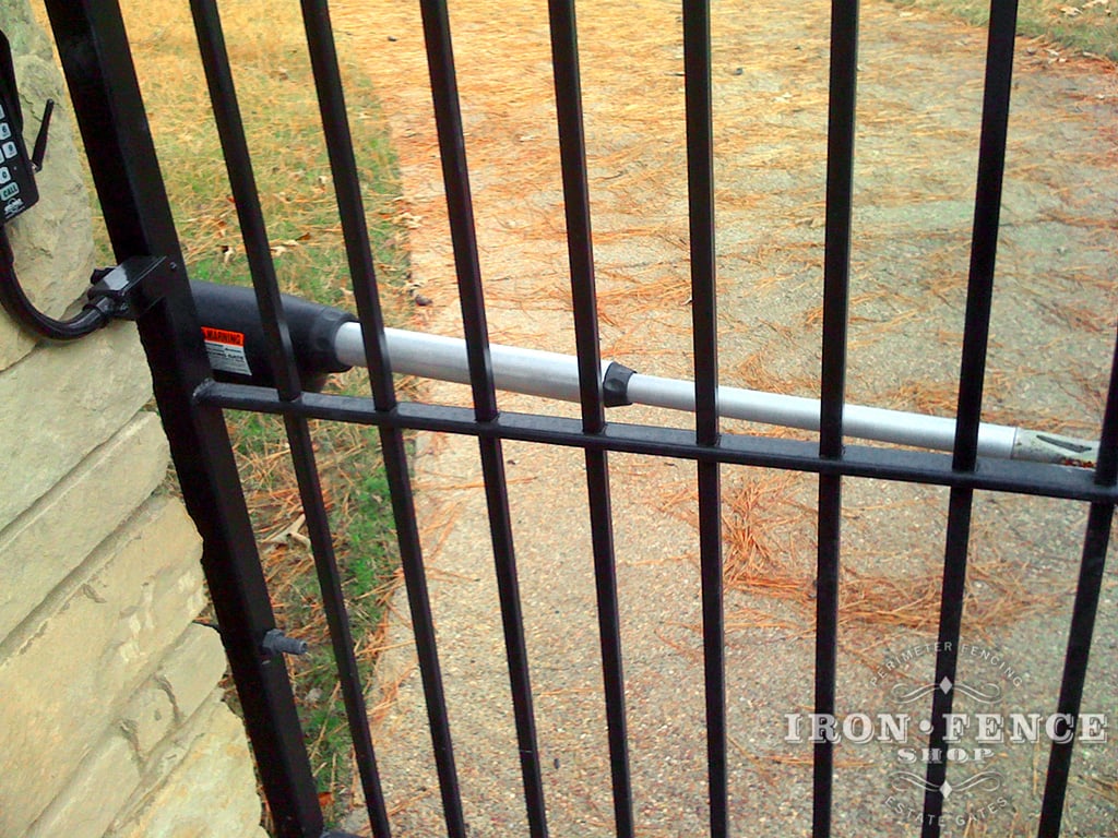 GTO PRO Automatic Gate Opener Motor Arm Mounted on a Wrought Iron Gate